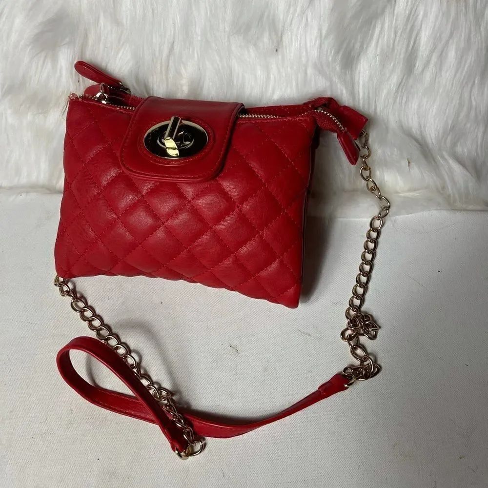 Aldo red quilted crossbody bag with gold tone latch closure.